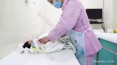 4K实拍护士为婴儿擦身体